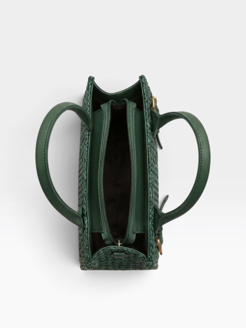 A top-down view of a structured green woven handbag with two circular handles and a zippered interior, shown on a light gray background.