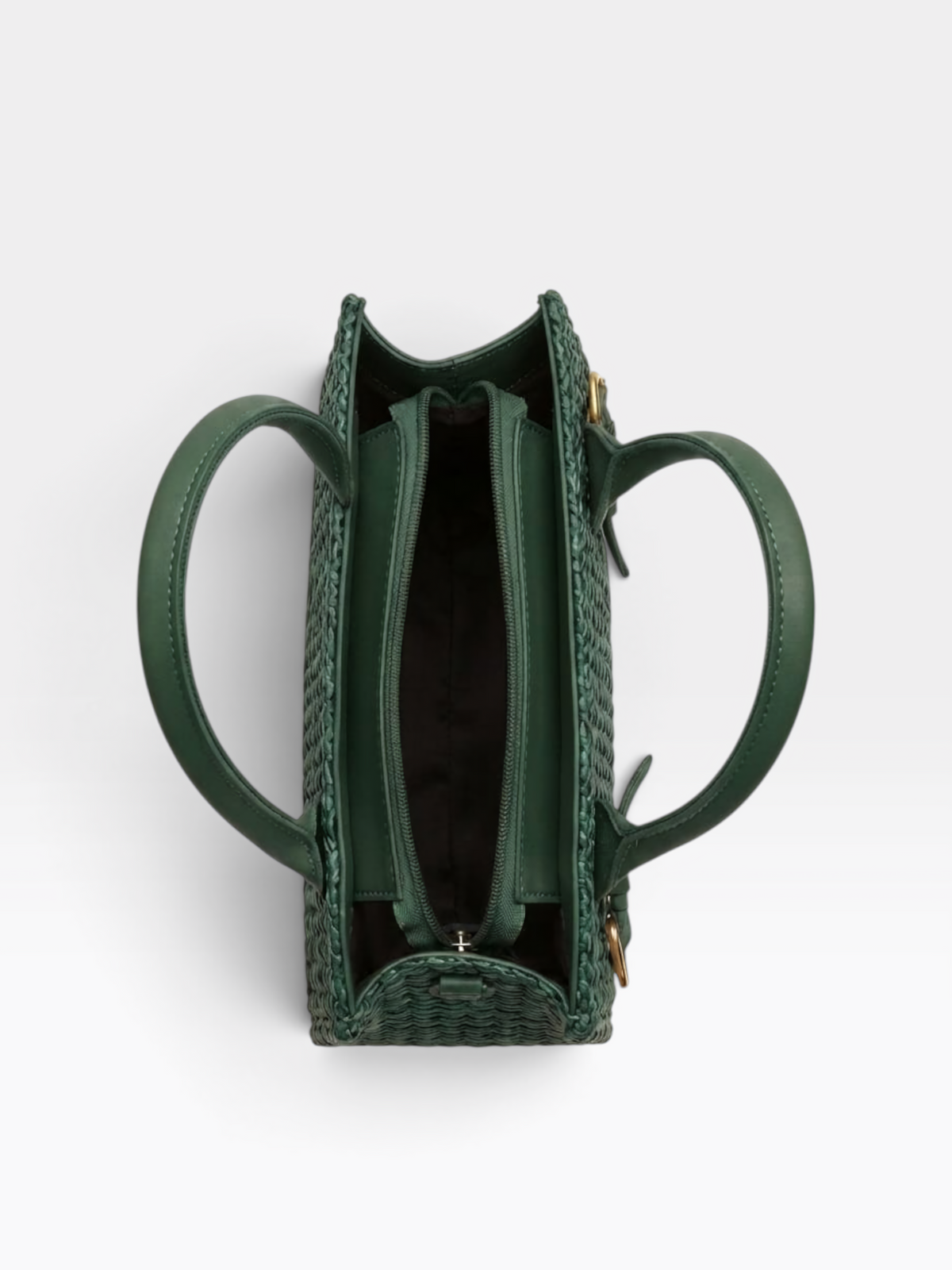 A top-down view of a structured green woven handbag with two circular handles and a zippered interior, shown on a light gray background.