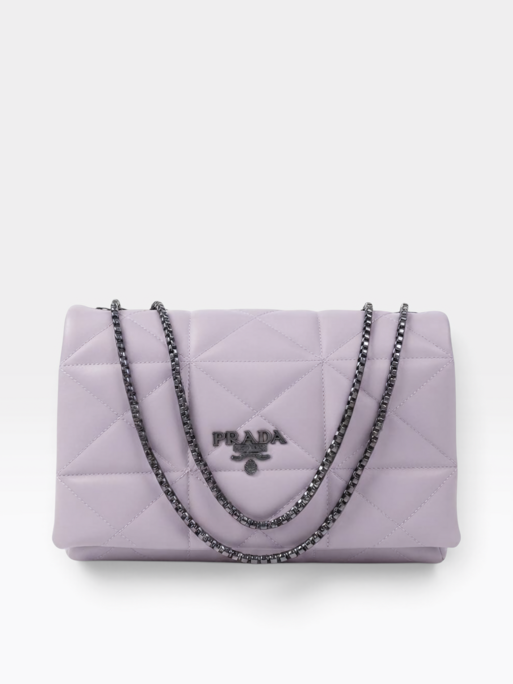 A light purple Prada quilted shoulder bag with a silver-tone chain strap and a silver-tone metal logo plaque on the front.