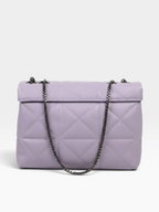 A lavender quilted leather shoulder bag with a dark metal chain strap, shown against a plain light gray background.