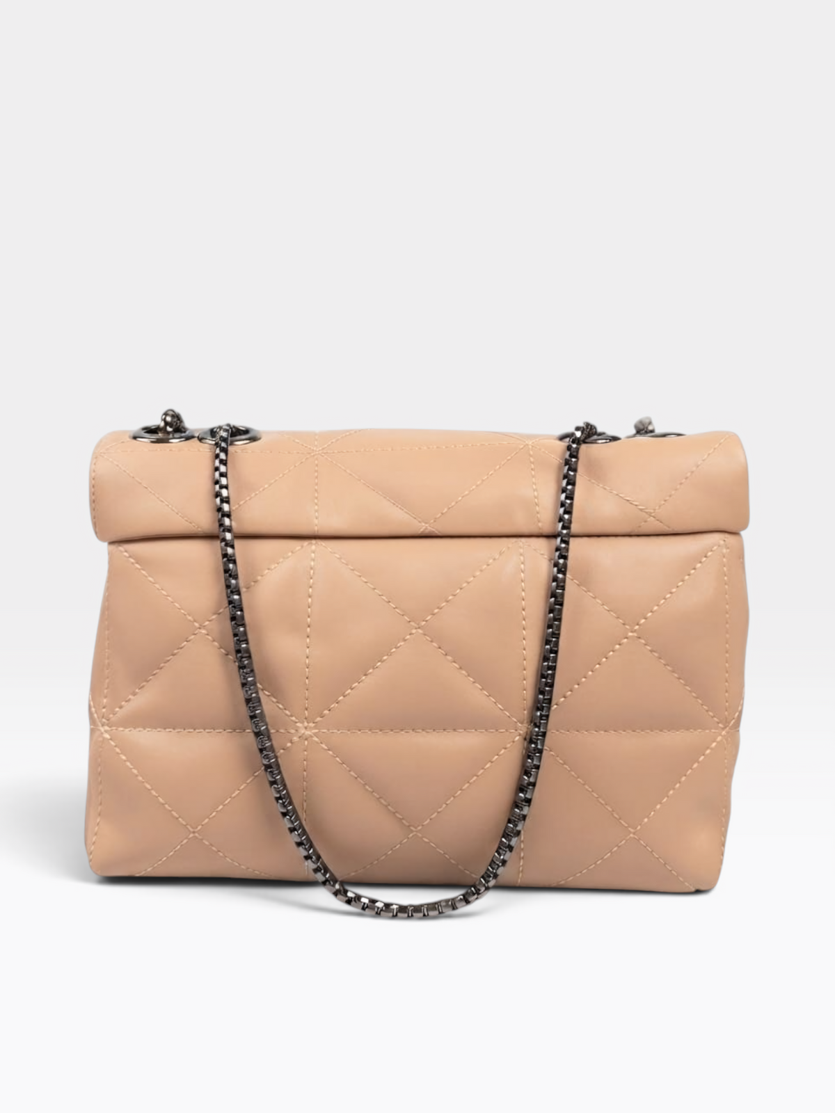 A structured quilted flap shoulder bag in light beige leather with a dark metallic chain strap, shown against a plain light gray studio background.