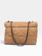 A tan quilted leather shoulder bag with a flap top and a dark metal chain strap, shown against a light gray background.